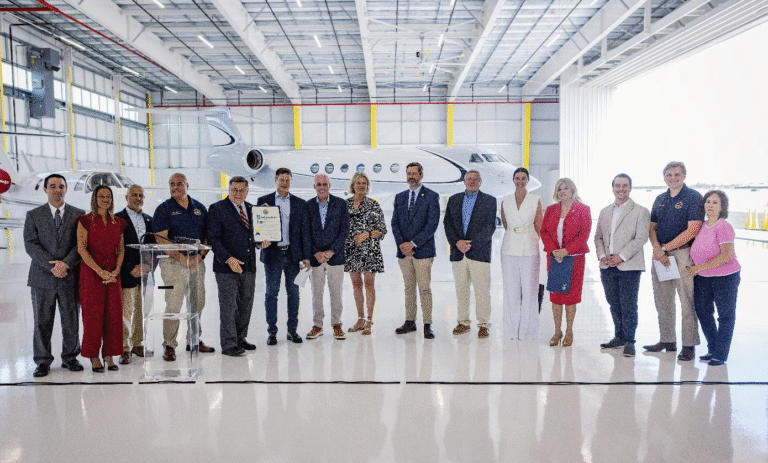 Suffolk County Executive Ed Romaine presents a proclamation to Mark Carmen, CEO of Modern Aviation, alongside local airport management and other state and local elected officials in celebration of the ribbon cutting for Modern Aviation’s new hangar and newly renovated FBO at Francis S. Gabreski Airport.