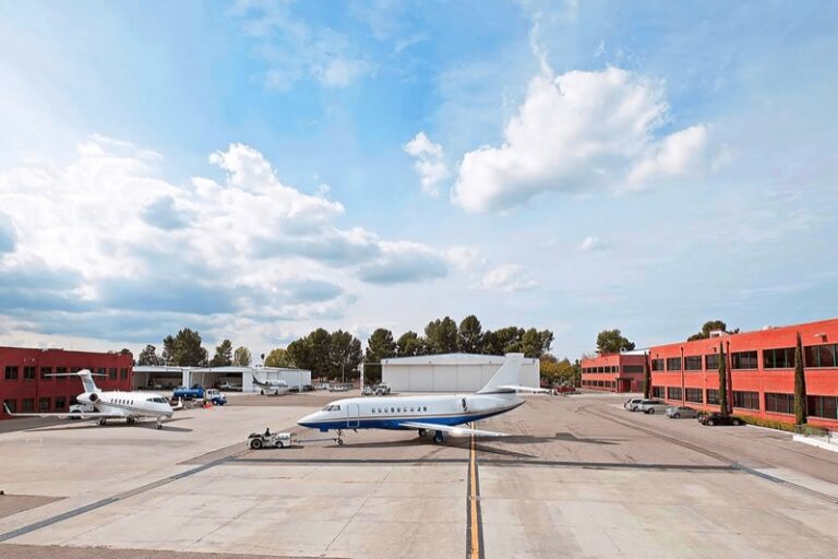 Signature Aviation acquires Castle & Cooke’s Van Nuys FBO Business jets on the ramp at a fixed-base operator at Van Nuys Airport, with hangars and terminal buildings